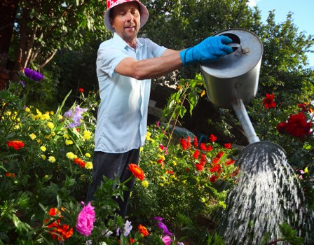 Professional gardeners maintaining a safe and tidy work area
